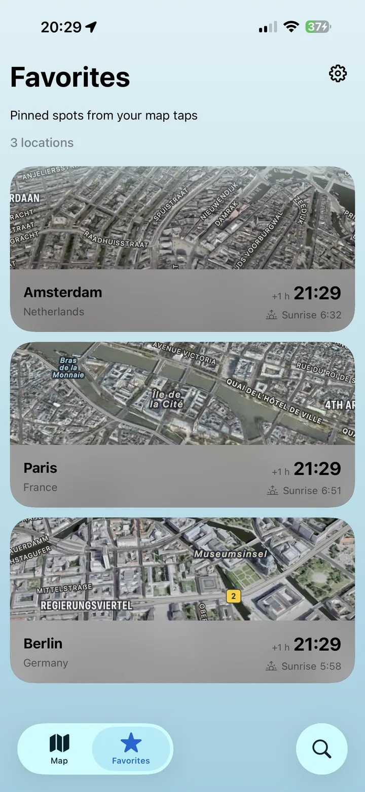 Favorites screen with satellite thumbnails of Amsterdam, Paris and Berlin and their local time